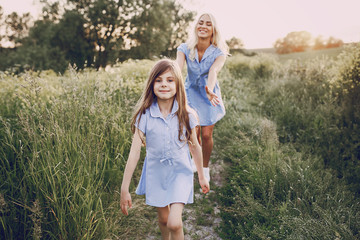 Fototapeta premium mom and daughter outside