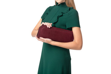 Woman holding a handbag isolated on white background