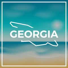 Georgia map rough outline against the backdrop of beach and tropical sea with bright sun.