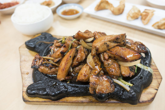 Marinated BBQ Chicken Hot Plate Dish at a Korean Food Restaurant