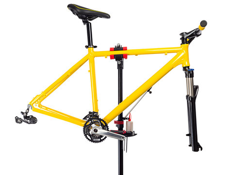 Fototapeta yellow mountain bike on repair stand at service / Gelbes Fahrrad auf Reperaturständer bei der Montage