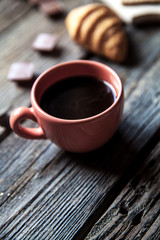 delicious breakfast with a cup of coffee and fruit sandwiches, croissants. Strawberries, food, drink, chocolate.