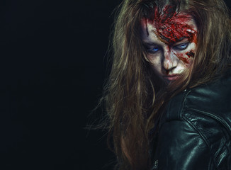 Close-up portrait of horrible zombie woman. Horror. Halloween