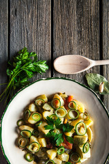 Tasty food. Vegetable stew on a wooden background. The rustic style.