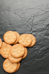 cracker stacked on black granite