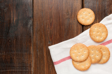 cracker stacked on white fabric over wood table