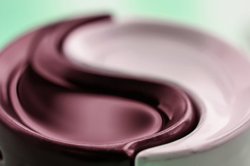 The symbol of Yin-Yang harmony and balance on a colored background