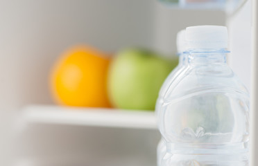 Bottles with water in refrigerator