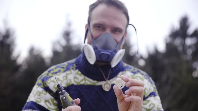 Man showing finished spiral pendant 4K