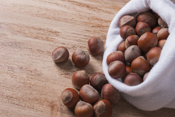The white bag with the unshelled nuts