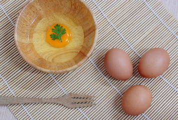 Fresh eggs on a wooden rustic background