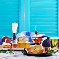 Pieces of Camembert and figs