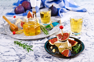 Pieces of Camembert and figs