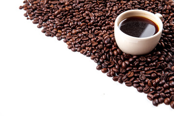 Coffee beans in coffee cup isolated on white