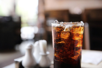 Cola drinking on wood background