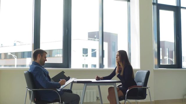 emotional woman answers the questions of the employer during the interview