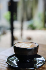 cappuccino coffee on wood background