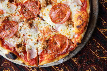 pepperoni pizza on wooden