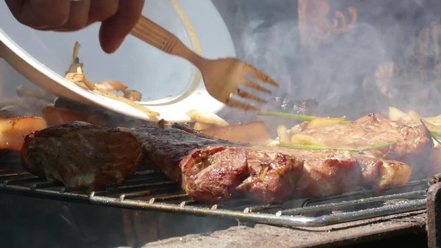 Close up of Pork Meat Steak on Barbecue Grill