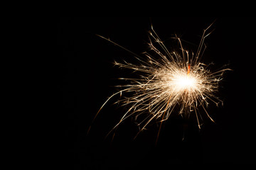 Firework Sparkler on black background, close-up. with copy space