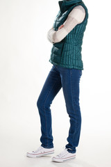 Naklejka premium Stylish vest, jeans and white sneakers.