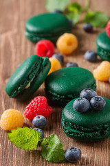 Fototapeta na wymiar Traditional French sweets. A green makorunas with mint, white an