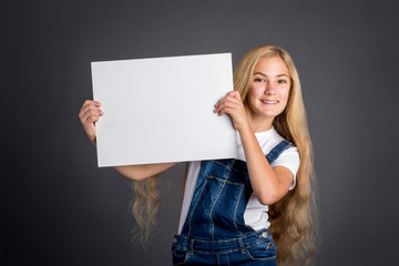 Girl holding white blank poster
