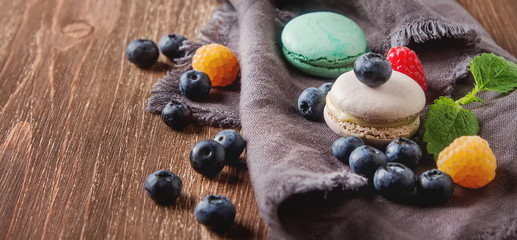 Traditional French sweets. Assorted colorful macaroons with mint