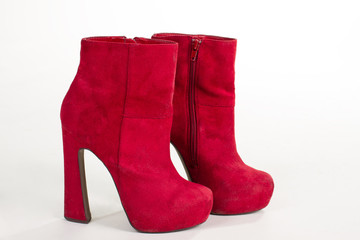 Pair of bright suede shoe with high heels.