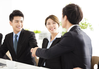 business people shaking hands during meeting