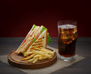 Fast food meals at sandwich bar, fries and cola drink