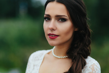 A portrait of a gorgeous brunette with wine lips