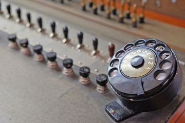 fragment of a vintage telephone switchboard with a dial