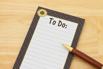A notepad and pen on a desk with text To Do and copy-space