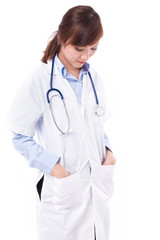 woman doctor looking down, studio isolated