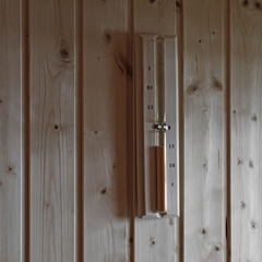 Obraz premium hourglass on wall in sauna room