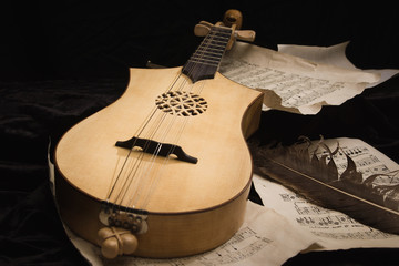 Renaissance lute (citole) with musical notes