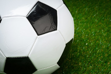 Fototapeta na wymiar soccer ball on the green field