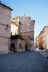 Morning sun illuminates old Italian buildings