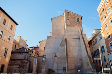 Fototapeta na wymiar Back side of old Italian building with three windows on the top