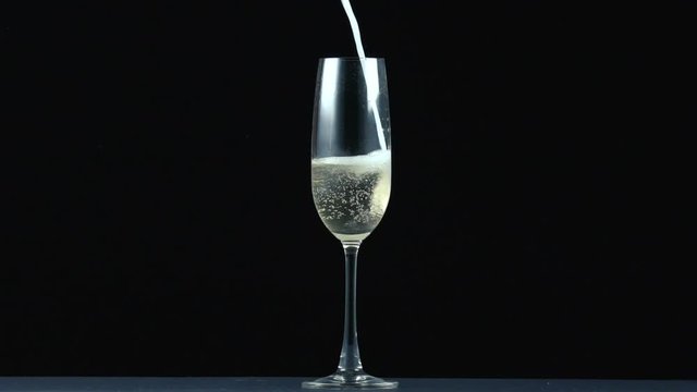 Pouring fizzy sparkling soda in glass