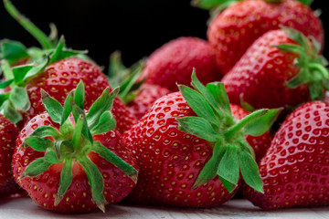 Fresh strawberry background. Ripe  in close-up.