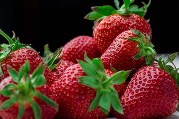 Fresh strawberry background. Ripe  in close-up.