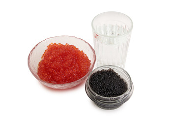 Fish caviar and glass of vodka on a white background
