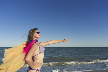 Girl on the beach enjoying a holiday at the sea.