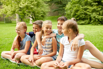 Fototapeta premium group of happy kids or friends outdoors