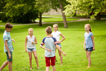 Fototapeta na wymiar happy kids playing game in summer park