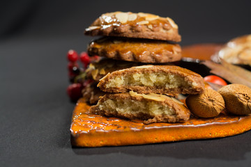 Typical Dutch filled spicy  cookies with almonds on autumn color