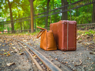 Vintage luggage, waiting for the tram. Autumn season