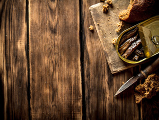 Smoked sprats with rye bread.